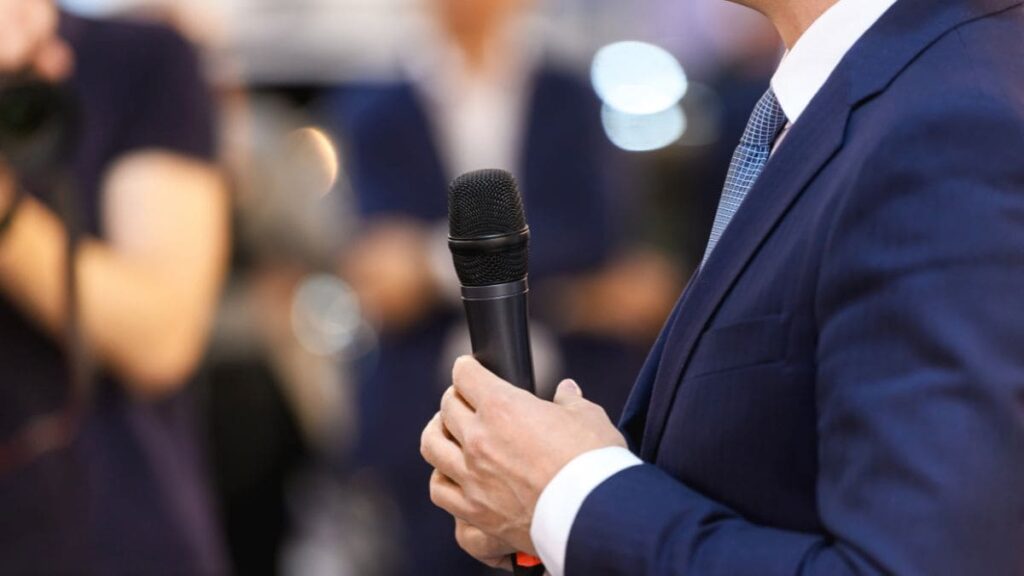 SVH Capital man holding a microphone